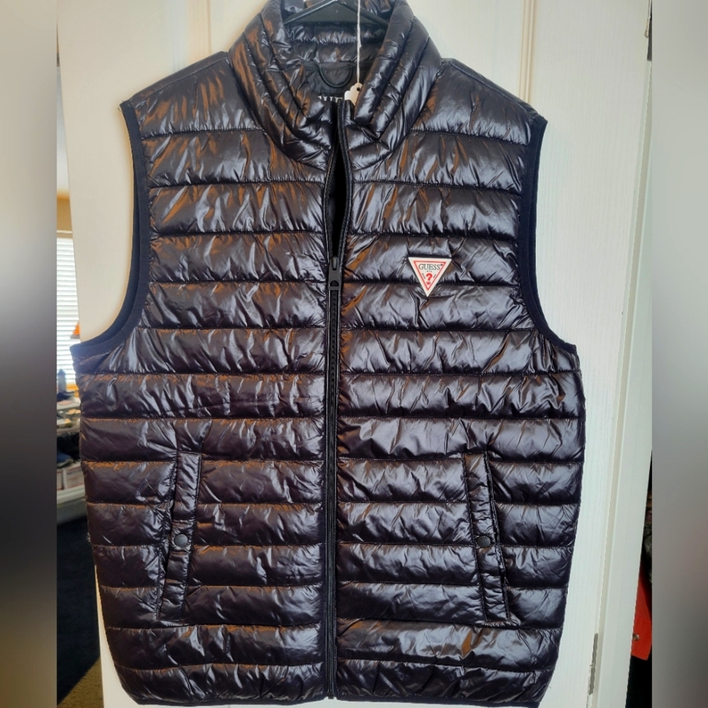 Men's size Med. Guess brand puffer vest. Excellent like new condition
